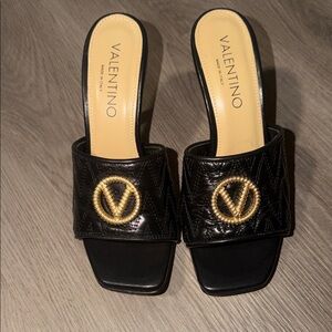 Valentino Black Mules with Gold Emblem